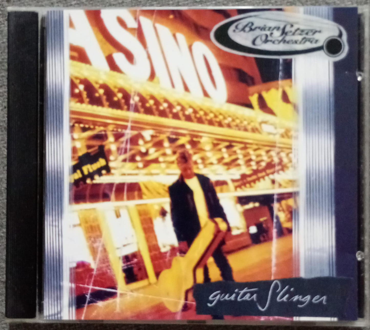 The Brian Setzer Orchestra – Guitar Slinger (CD importado, excelente estado). tienda de discos en méxico formato muerto