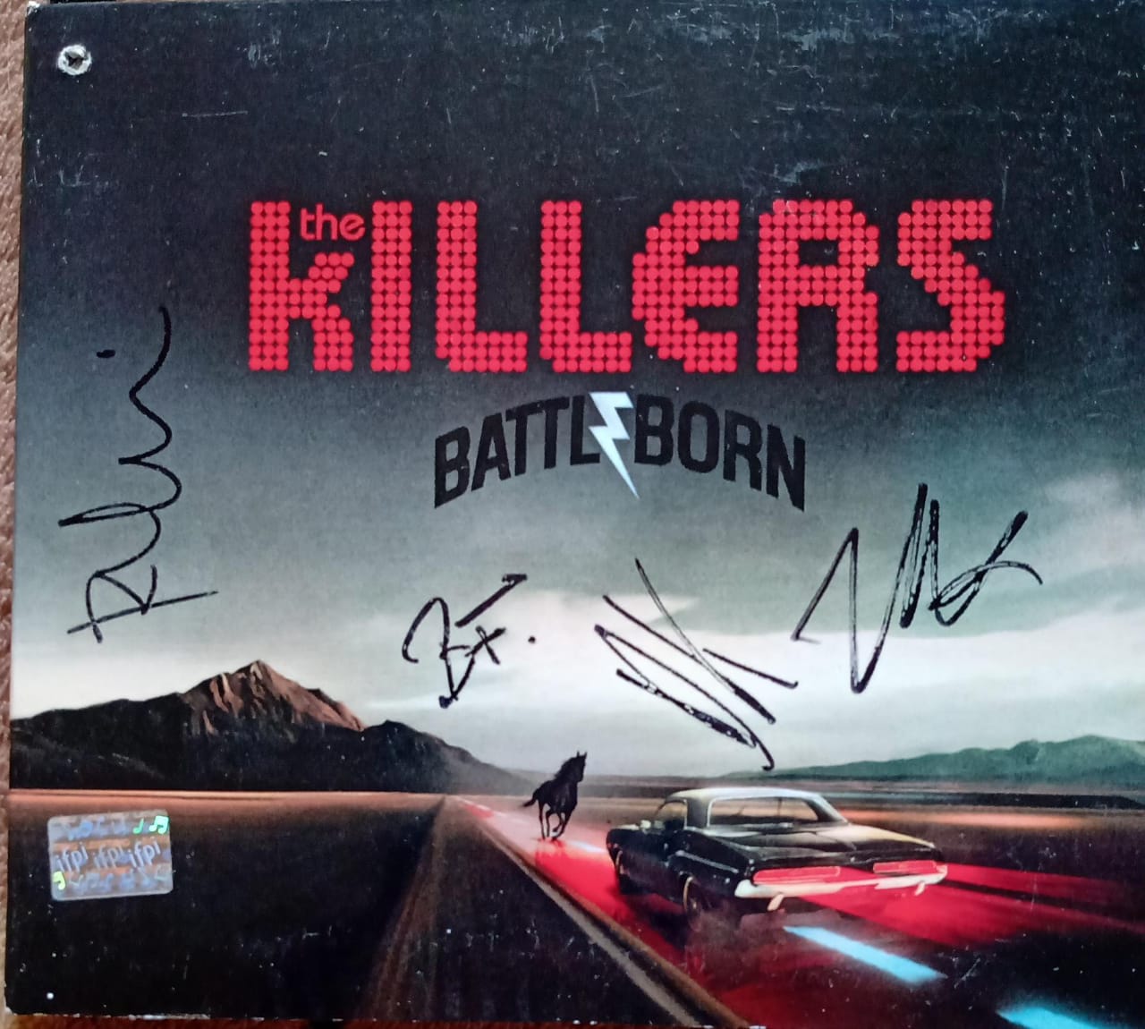 The Killers – Battle Born (CD en excelente estado, autografiado).
