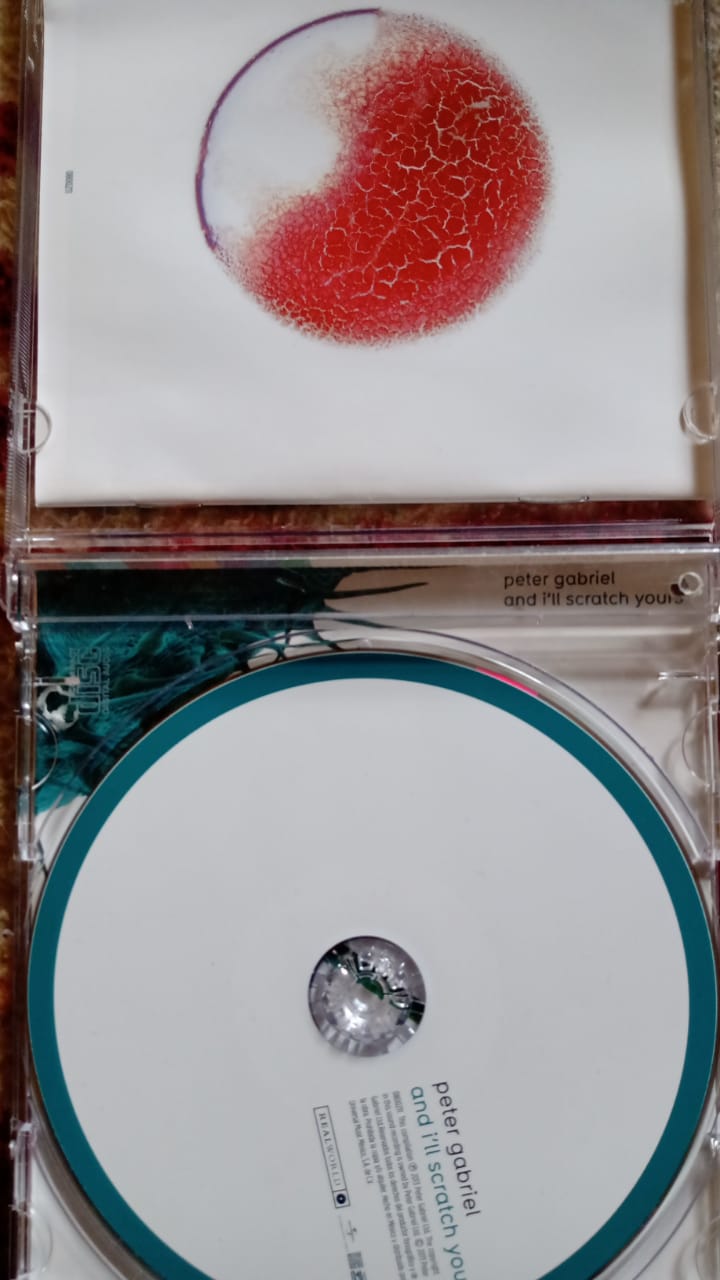 Peter Gabriel – And I'll Scratch Yours (CD en excelente estado).